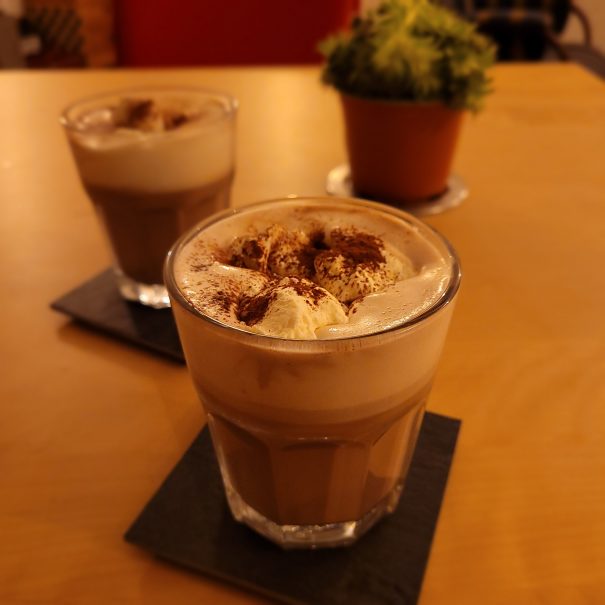 Glas with hot chocolate and whipped cream
