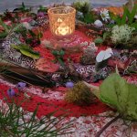 A circle altar with candle at the Women's Retreat and Women's Circle
